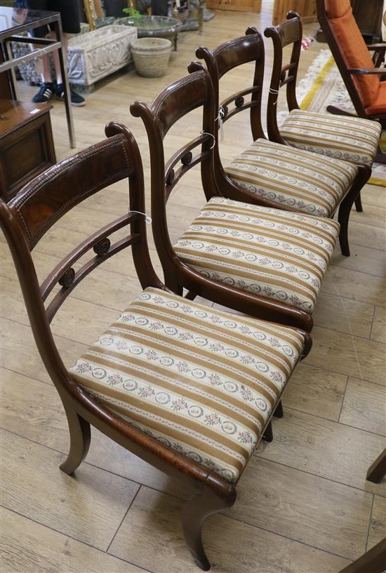 A set of four Regency style mahogany dining chairs